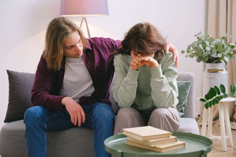 Guy Comforting Girl Who is Grieving
