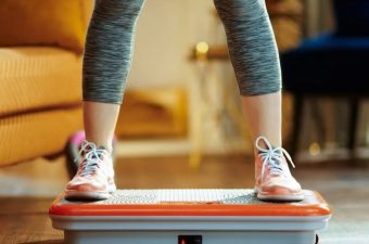 woman-standing-on-vibration-plate